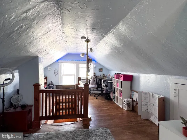 a view of a park with large trees