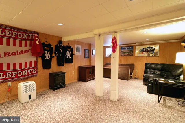 a view of a house with a wooden deck