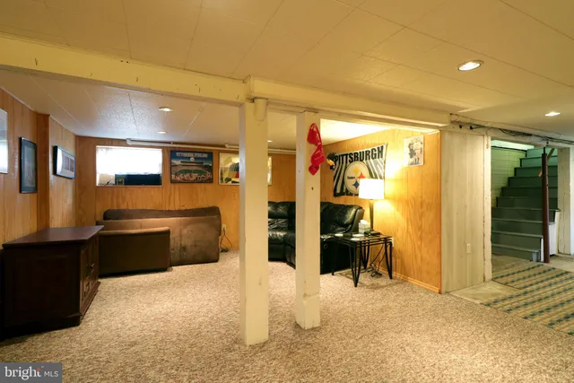 a swimming pool view with a seating space