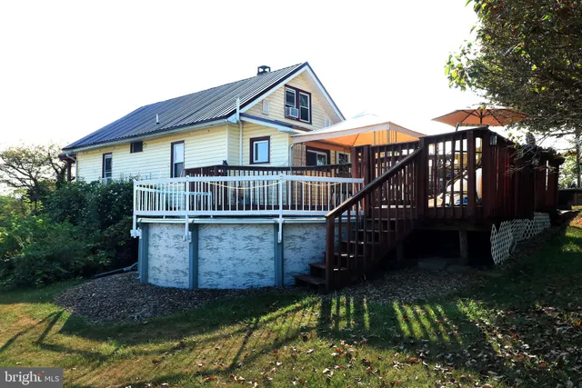 an aerial view of a house with a garden