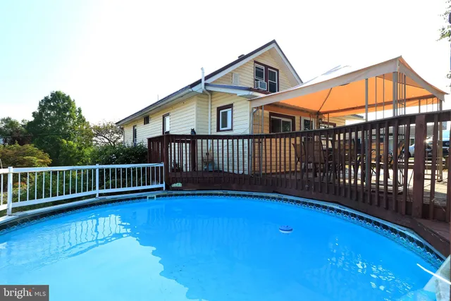 an aerial view of residential house with outdoor space