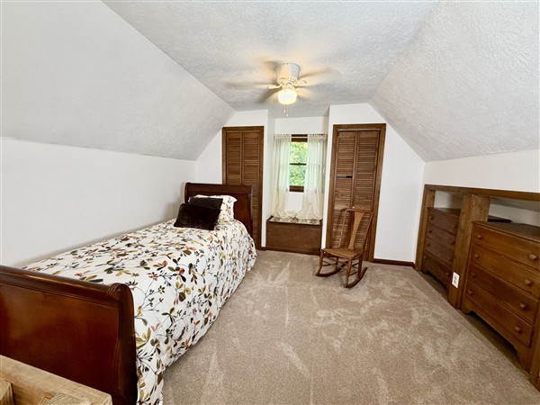 238 Trails End Road Blue Ridge, GA 30513 - Photo 21 of 32 a bedroom with bed and wooden floor