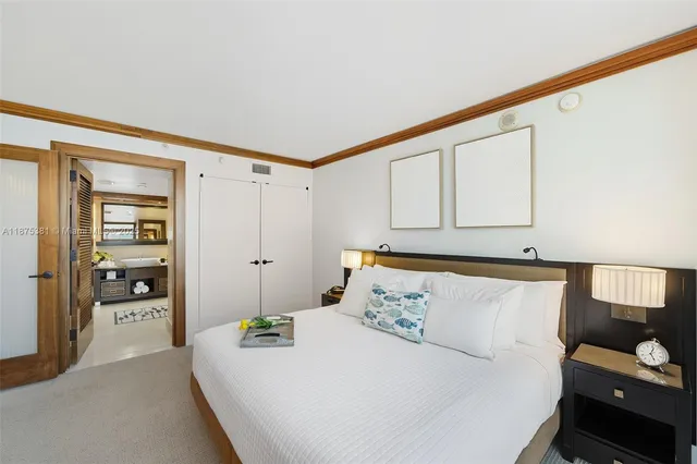 a bedroom with a bed and a cabinets