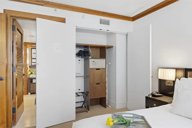 a bedroom with a bed and a couch