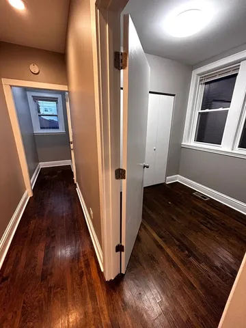 a view of an entryway with wooden floor