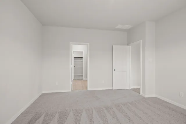 a view of an empty room and entryway