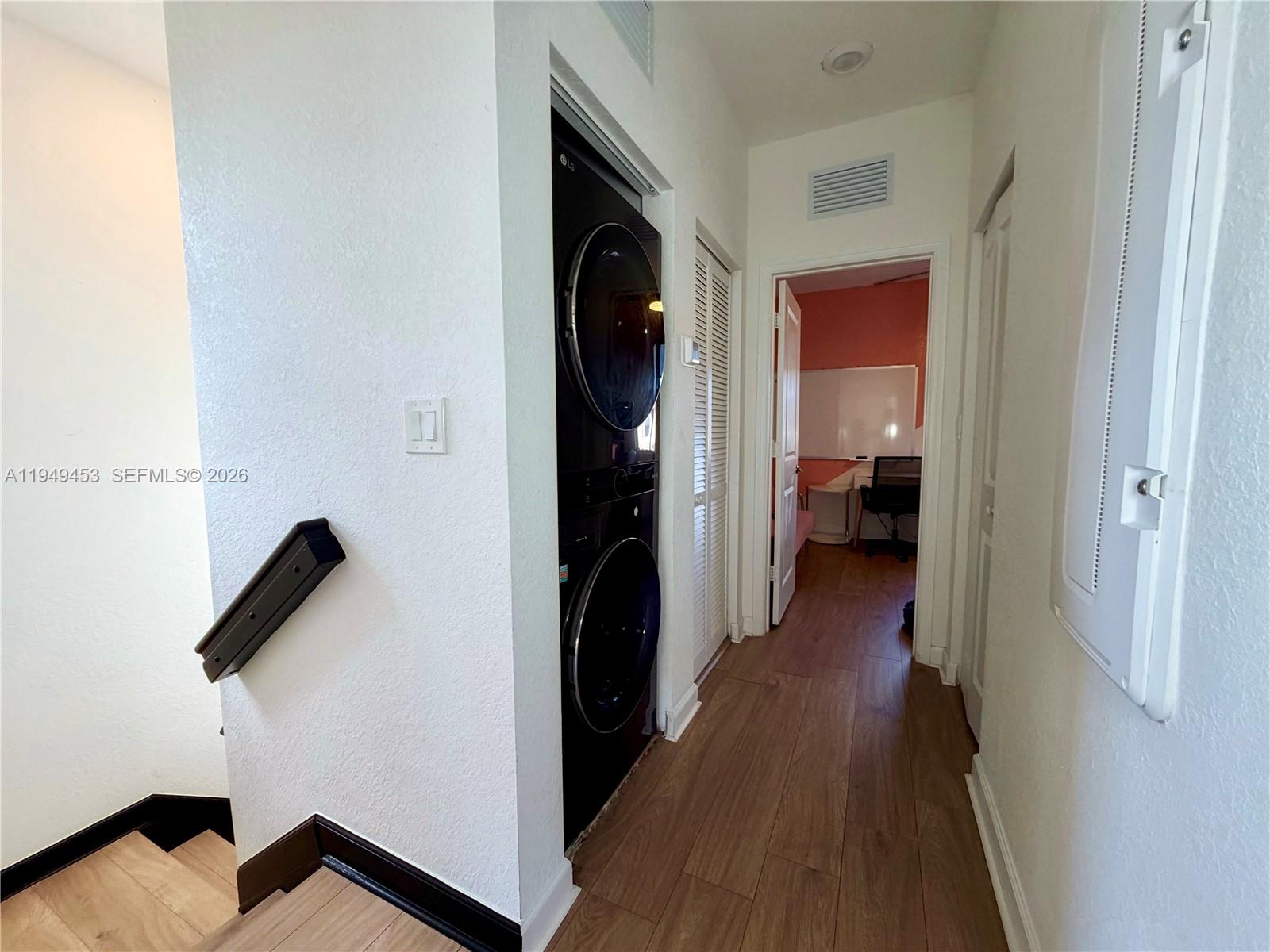 12990 Southwest 232nd Lane Homestead, FL 33032 - Photo 13 of 20 a view of hallway with wooden floor