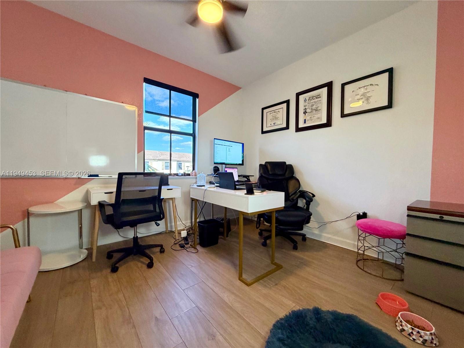 12990 Southwest 232nd Lane Homestead, FL 33032 - Photo 15 of 20 a view of a workspace with furniture and a window