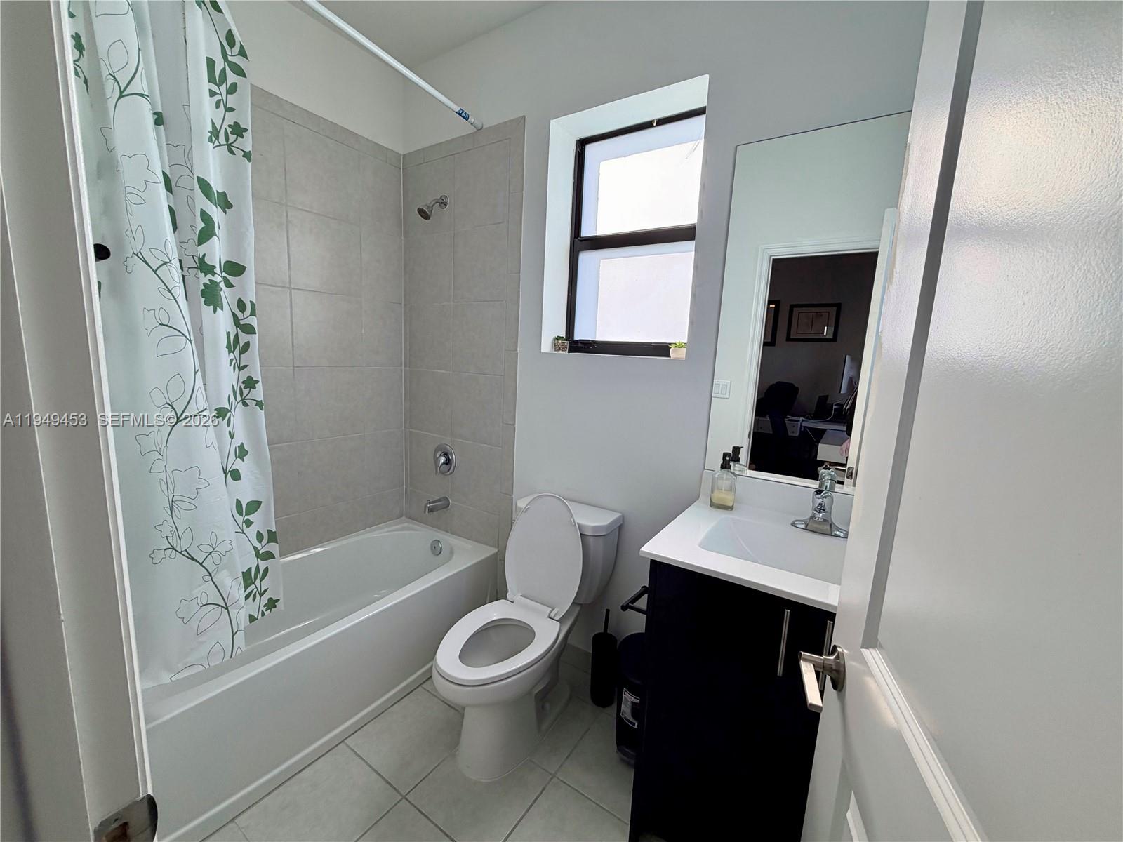 12990 Southwest 232nd Lane Homestead, FL 33032 - Photo 17 of 20 a bathroom with a toilet a sink and bathtub