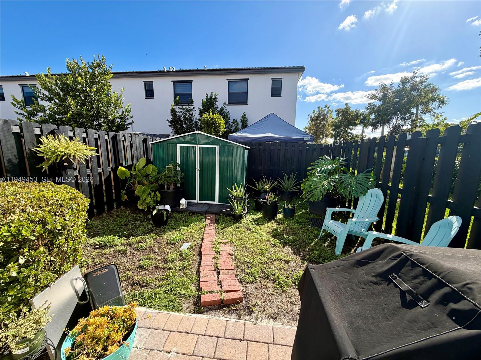 12990 Southwest 232nd Lane Homestead, FL 33032 - Photo 20 of 20 a view of house with patio outdoor seating