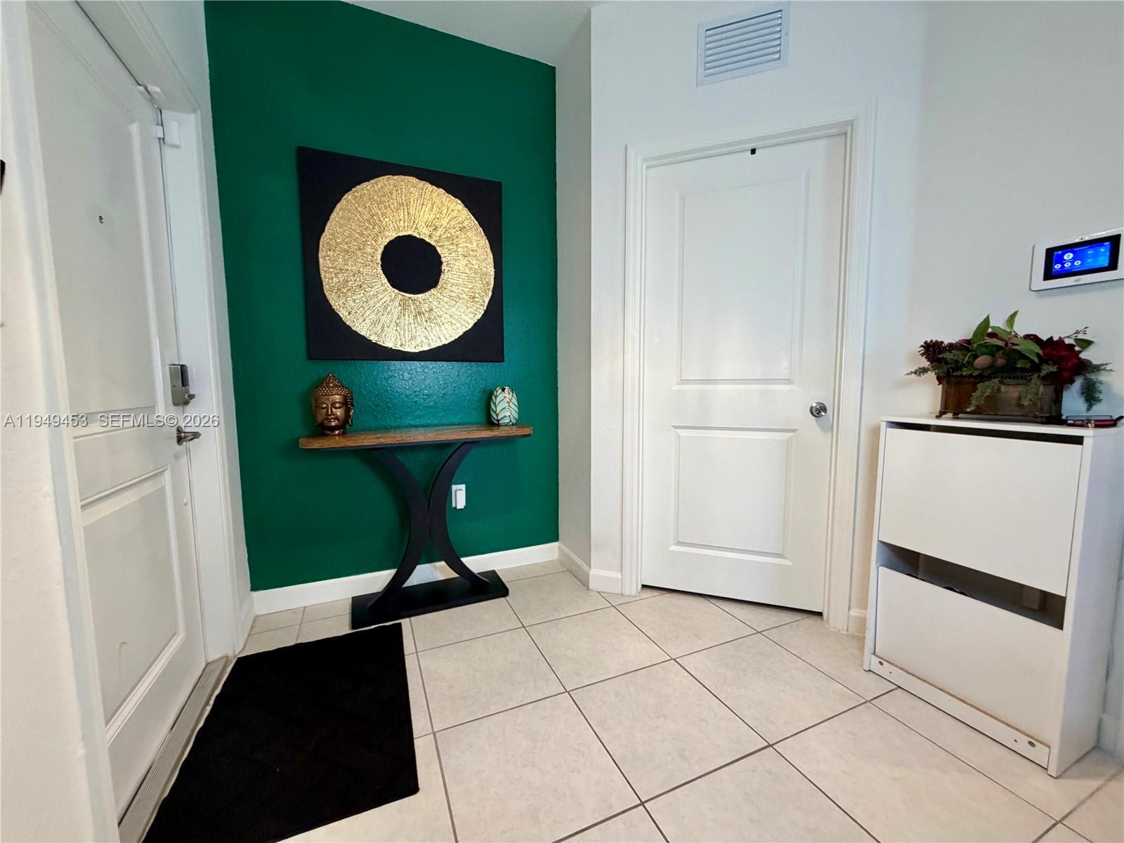 12990 Southwest 232nd Lane Homestead, FL 33032 - Photo 3 of 20 a view of entryway and hall with a window