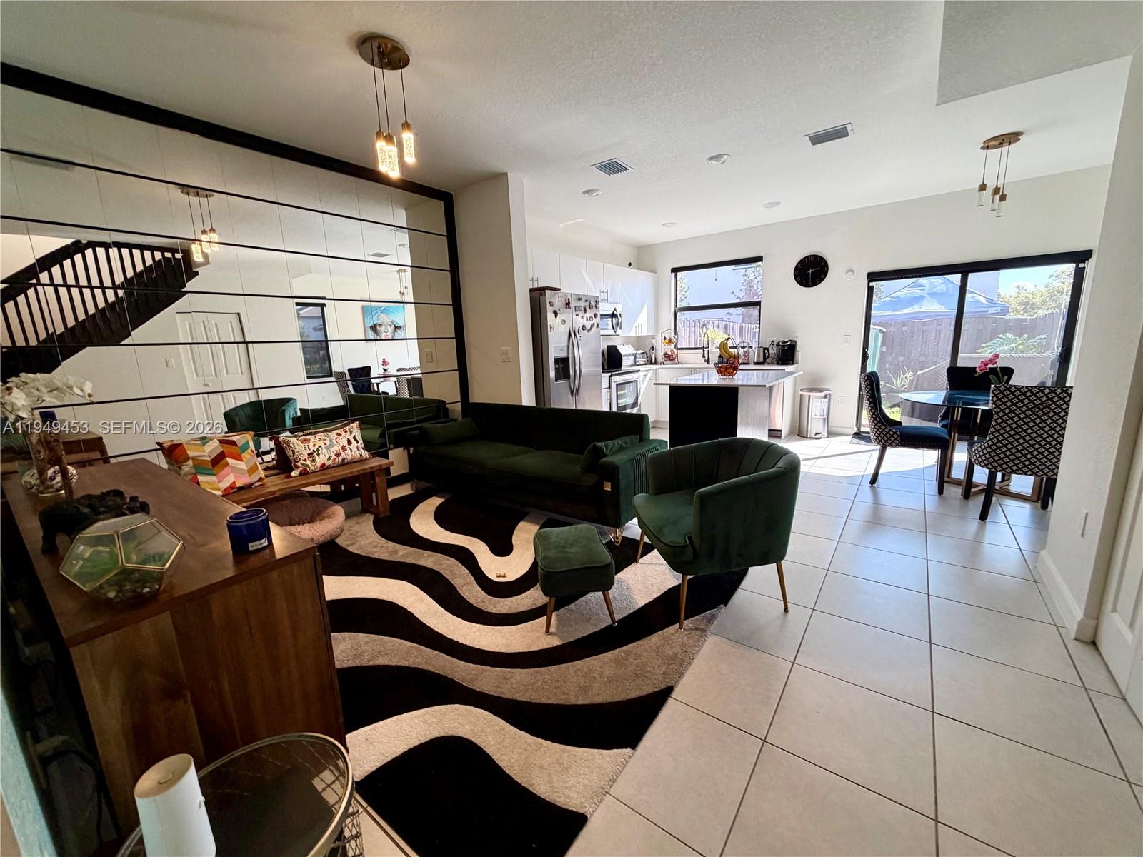 12990 Southwest 232nd Lane Homestead, FL 33032 - Photo 4 of 20 a living room with furniture and a window