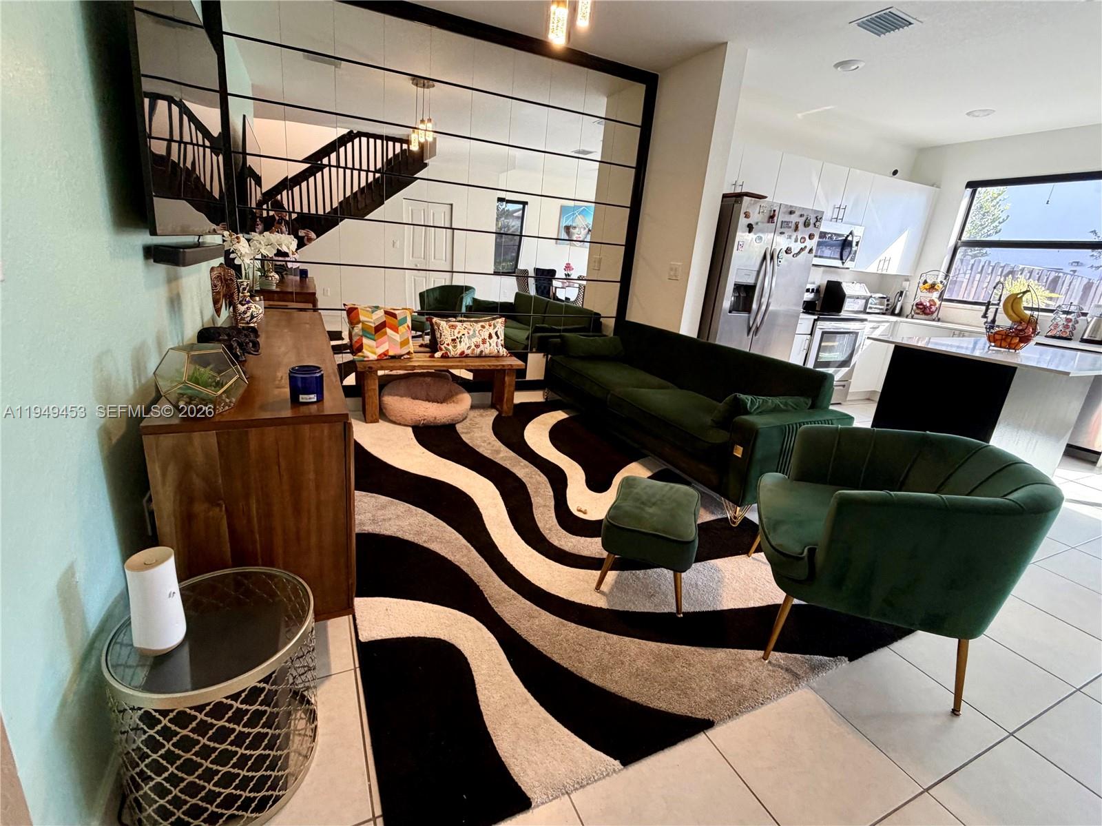 12990 Southwest 232nd Lane Homestead, FL 33032 - Photo 5 of 20 a room with furniture and a window