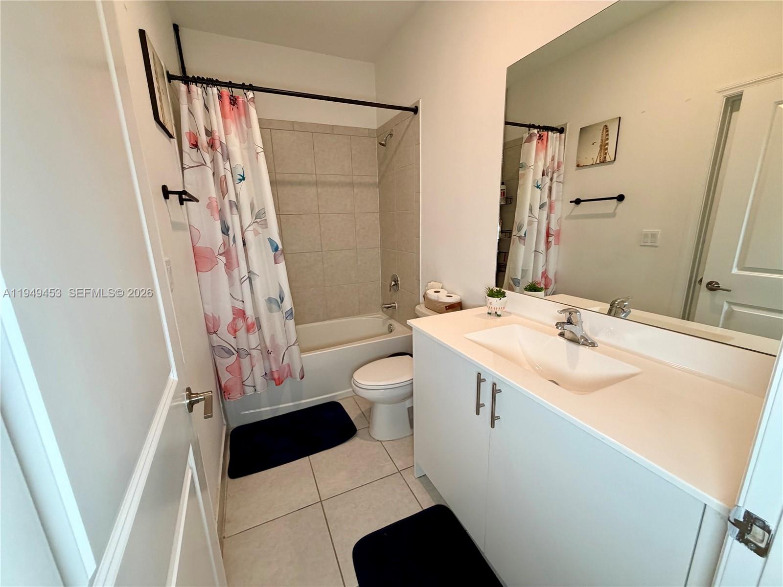 12990 Southwest 232nd Lane Homestead, FL 33032 - Photo 10 of 20 a bathroom with a sink a toilet and shower