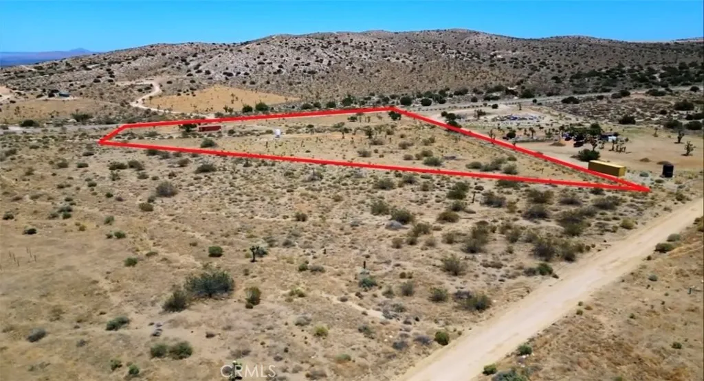 11250 Fort Tejon Road Pearblossom, CA 93553 - Photo 2 of 7 a view of a area with mountains in the background
