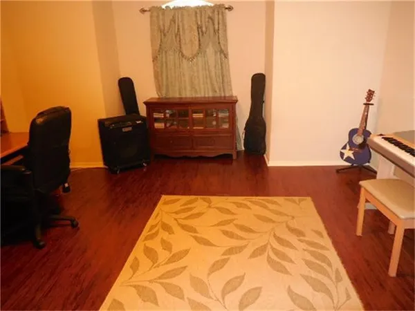 a bedroom with a bed and a chair