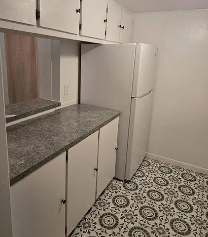 a view of a storage and utility room with closet