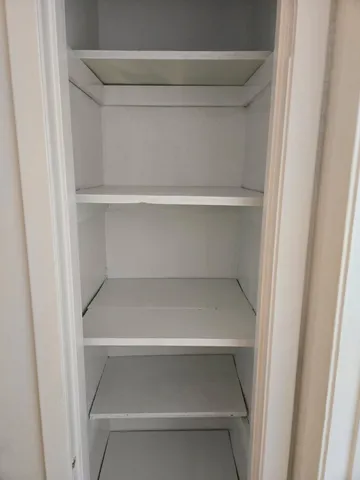 a bathroom with a toilet sink and shower