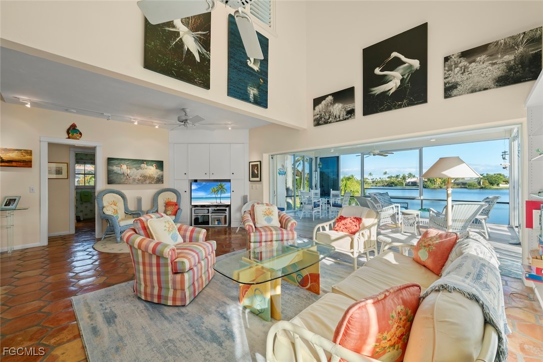 1401 Sand Castle Road Sanibel, FL 33957 - Photo 11 of 50 a living room with furniture fireplace and kitchen view