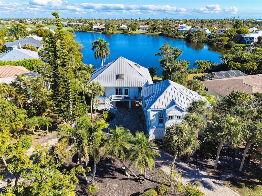 1401 Sand Castle Road Sanibel, FL 33957 - Photo 2 of 50 an aerial view of a house with a lake view