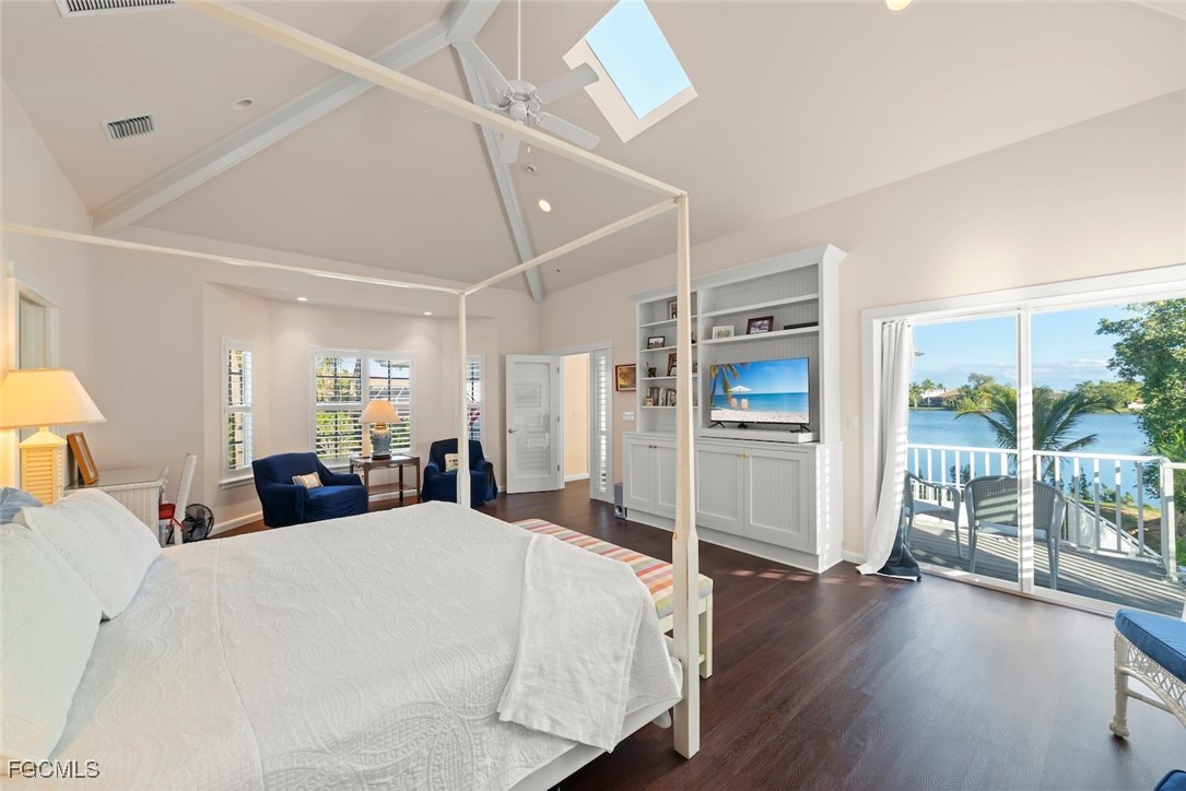 1401 Sand Castle Road Sanibel, FL 33957 - Photo 25 of 50 a large bedroom with wooden floor and window