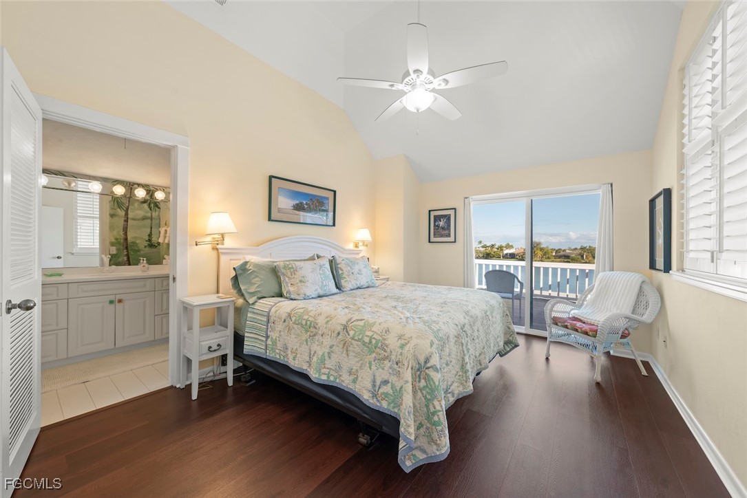1401 Sand Castle Road Sanibel, FL 33957 - Photo 38 of 50 a spacious bedroom with a bed and wooden floor