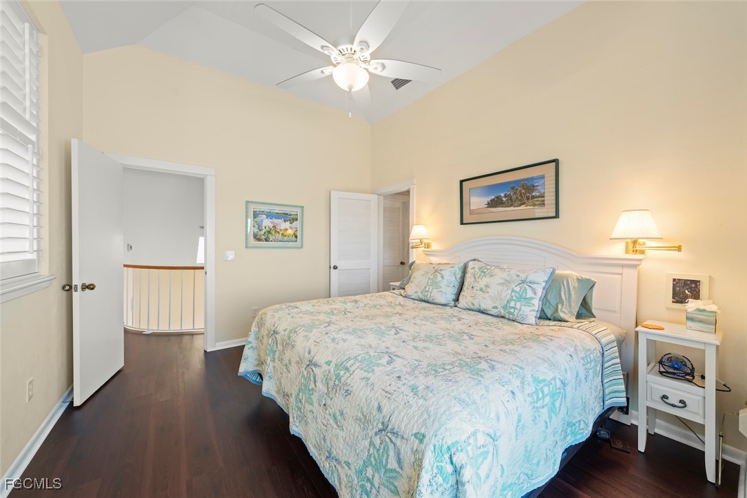 1401 Sand Castle Road Sanibel, FL 33957 - Photo 39 of 50 a bedroom with a bed and a chandelier