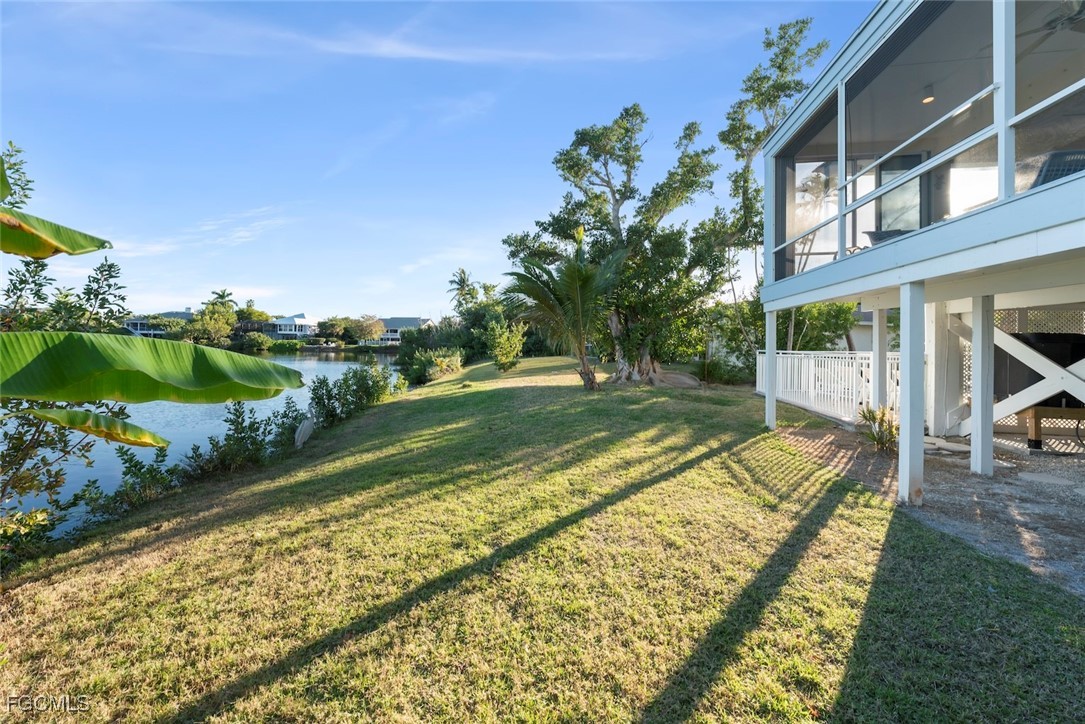 1401 Sand Castle Road Sanibel, FL 33957 - Photo 45 of 50 a view of a house with a yard