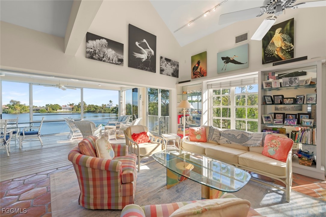 1401 Sand Castle Road Sanibel, FL 33957 - Photo 5 of 50 a living room with furniture and a large window