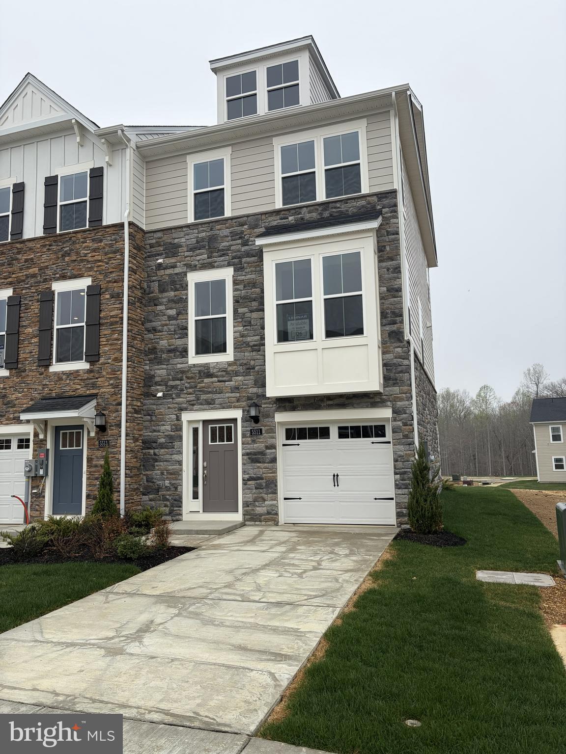 5511 Aberdeen Place White Plains, MD 20695 - Photo 1 of 6 a front view of a house with a yard