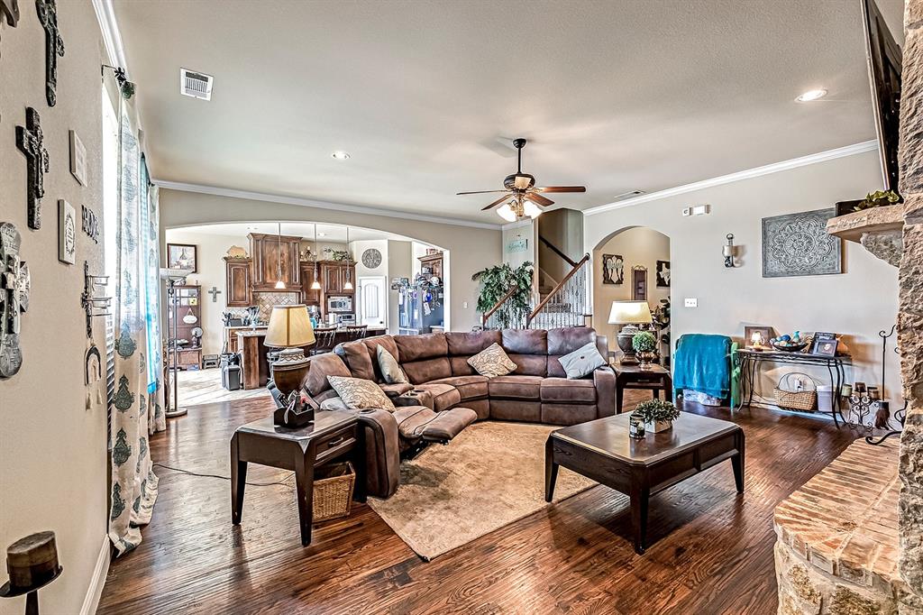 3206 Meadow Ridge Drive Midlothian, TX 76065 - Photo 17 of 37 a living room with furniture and wooden floor
