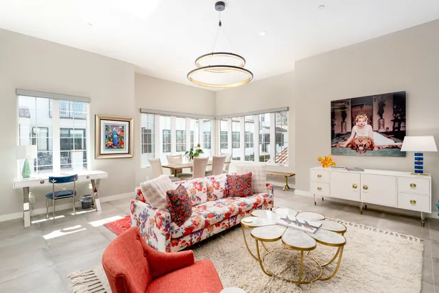 a living room with furniture and a table