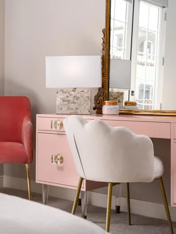 a bedroom with bed wooden floor and window