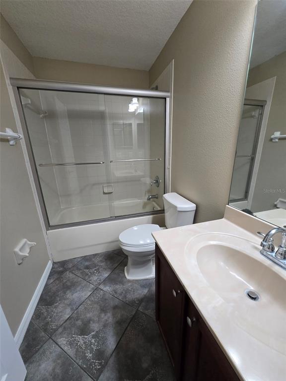 12905 Trade Port Place Riverview, FL 33579 - Photo 12 of 14 a bathroom with a sink a toilet and shower