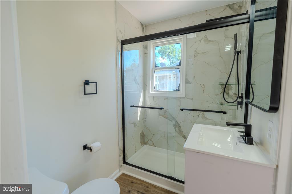 12324 Centerhill Street Silver Spring, MD 20902 - Photo 16 of 24 a bathroom with a sink toilet and tub