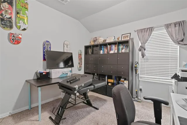 a work room with furniture and a window