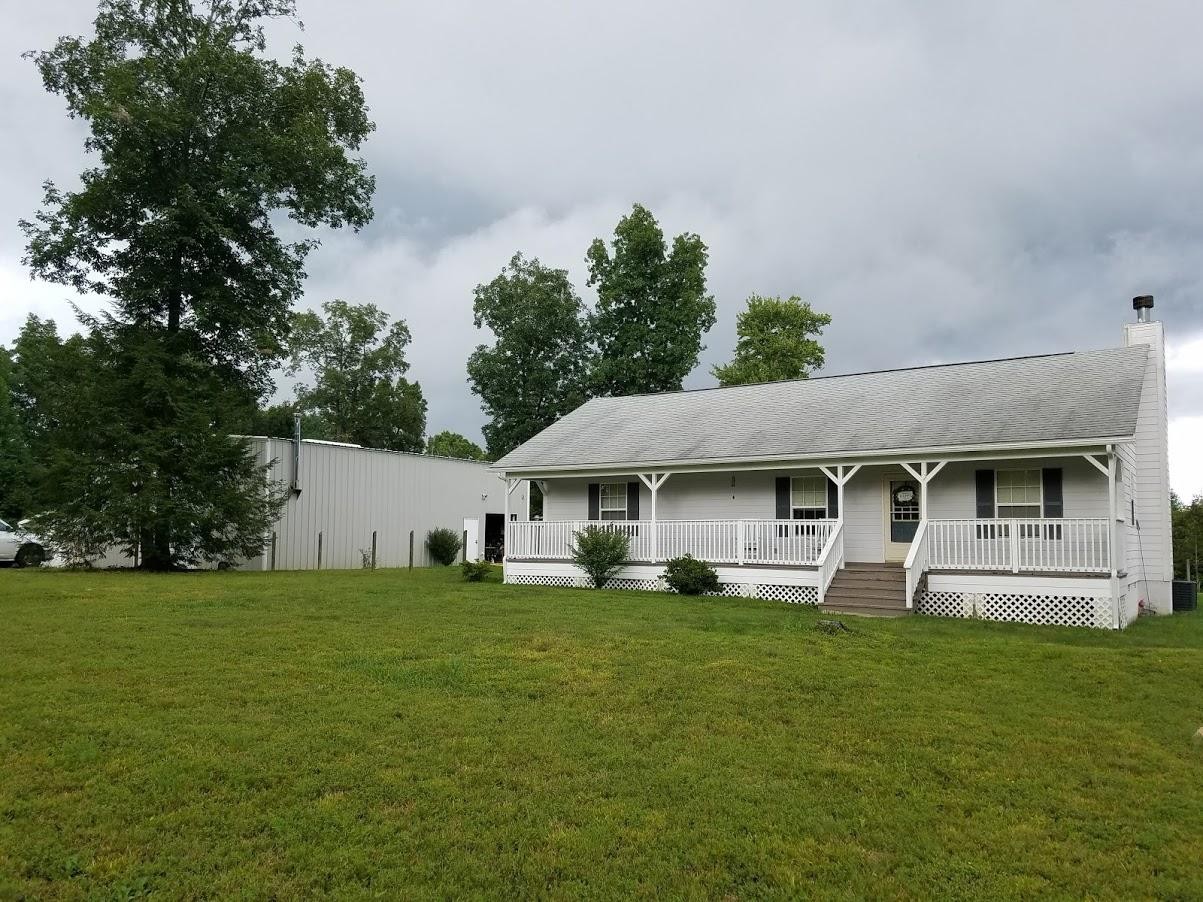 467 Ridge Road Lancing, TN 37770 - Photo 2 of 40 a house view with a garden space
