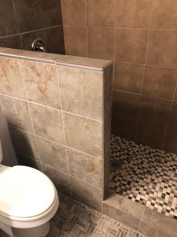 467 Ridge Road Lancing, TN 37770 - Photo 21 of 40 a bathroom with a toilet and a shower