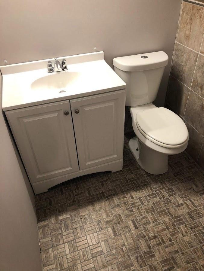 467 Ridge Road Lancing, TN 37770 - Photo 22 of 40 a bathroom with a toilet sink and mirror
