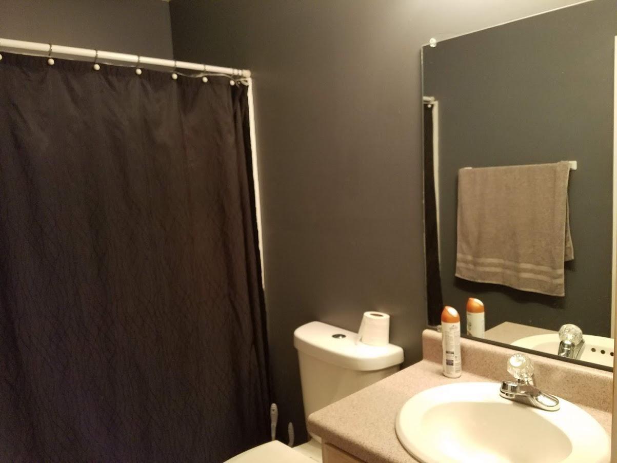 467 Ridge Road Lancing, TN 37770 - Photo 24 of 40 a bathroom with a sink mirror vanity and toilet