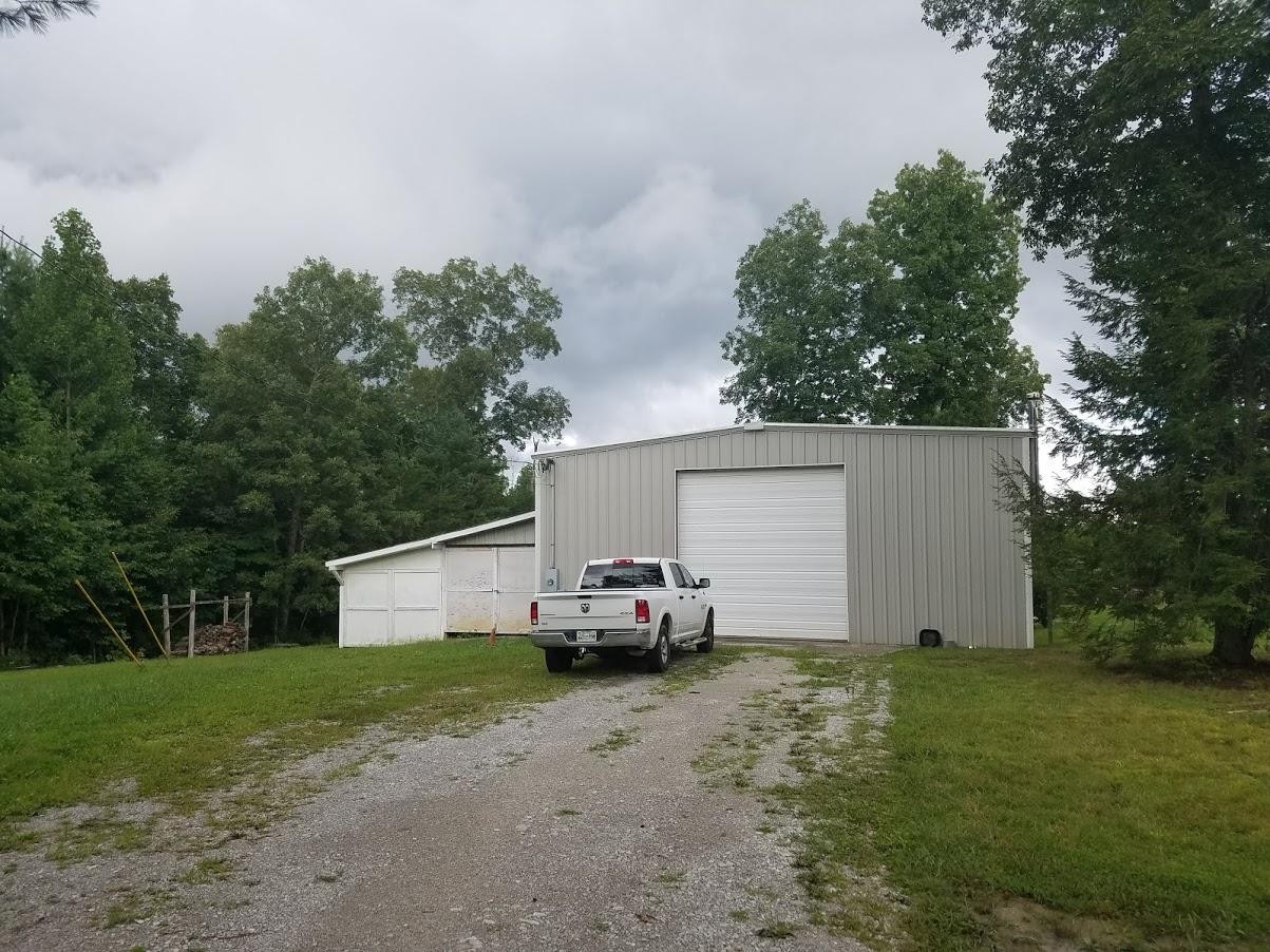 467 Ridge Road Lancing, TN 37770 - Photo 27 of 40 a car parked in front of house