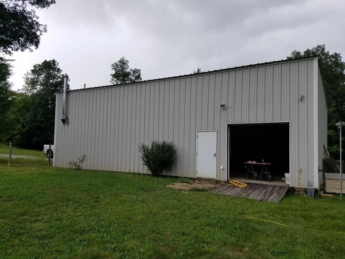 467 Ridge Road Lancing, TN 37770 - Photo 31 of 40 a backyard of a house with lots of green space