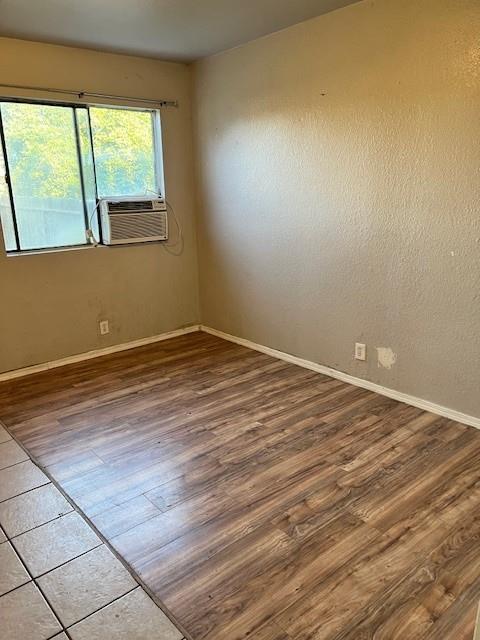 325 North 7th Street Fowler, CA 93625 - Photo 8 of 10 a view of an empty room with wooden floor and a window