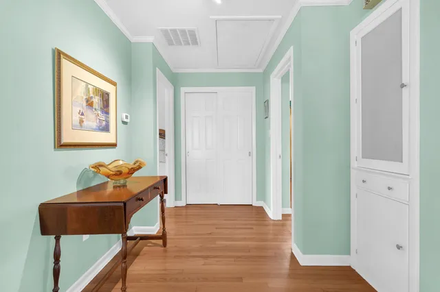 a room with wooden floor and furniture