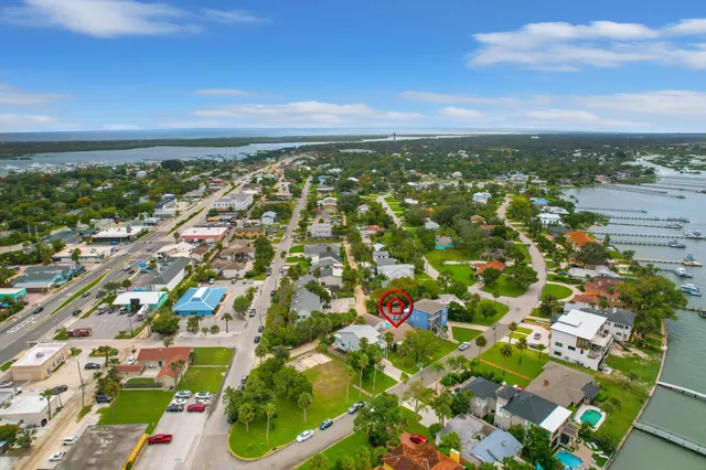 an aerial view of residential houses with outdoor space