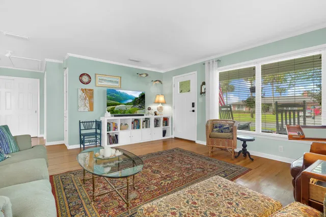 a living room with furniture and a table