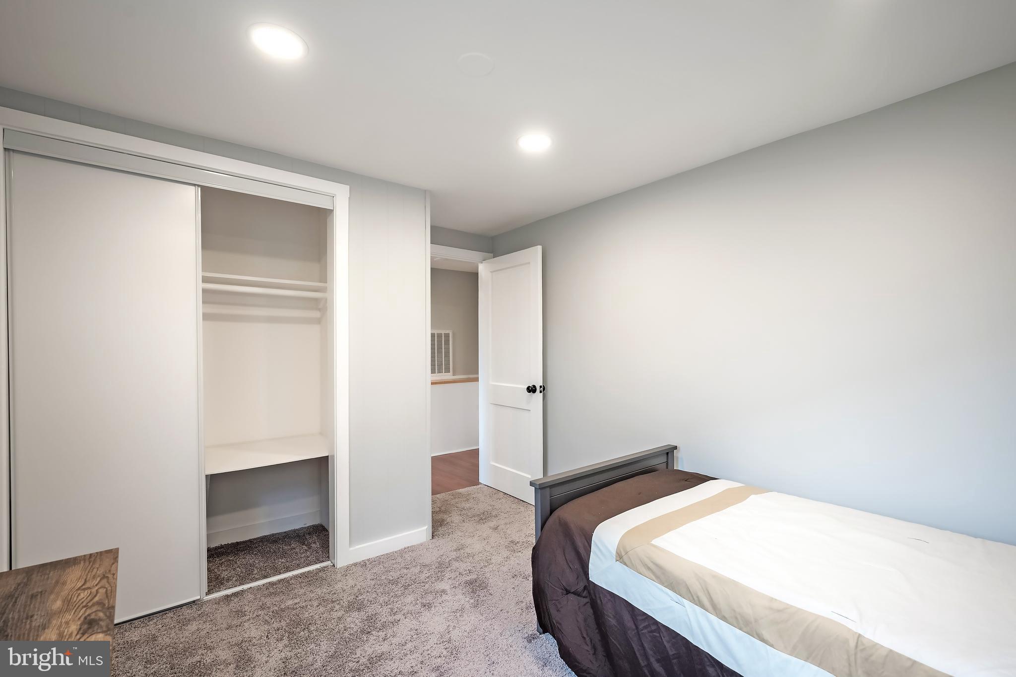 6946 Blantyre Road Warrenton, VA 20187 - Photo 11 of 24 a bedroom with a bed and a cabinet