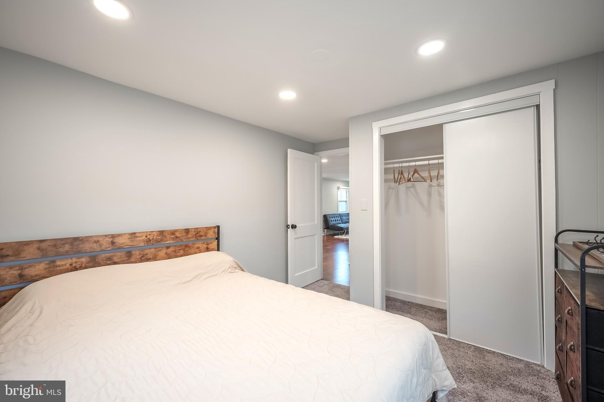 6946 Blantyre Road Warrenton, VA 20187 - Photo 13 of 24 a bedroom with a bed and a mirror
