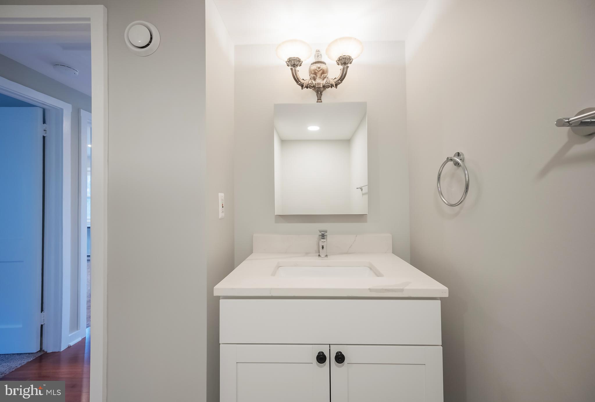 6946 Blantyre Road Warrenton, VA 20187 - Photo 16 of 24 a bathroom with a sink and a mirror