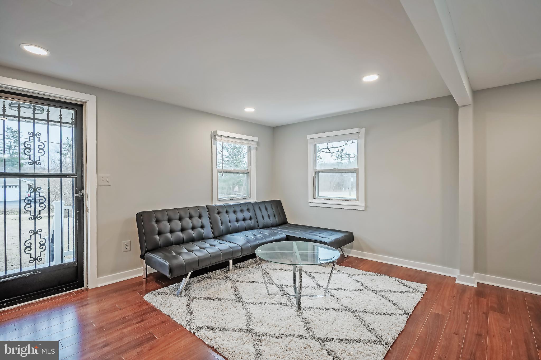 6946 Blantyre Road Warrenton, VA 20187 - Photo 17 of 24 a living room with furniture and a window